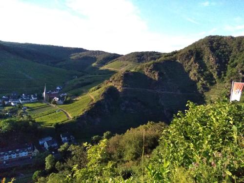 a view of a mountain with a village on it at Am Bungert in Mayschoß