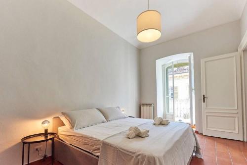 Кровать или кровати в номере Mazzini quarto