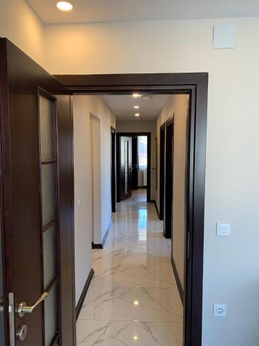 an empty hallway with doors and a hallwayngth at Royal Residence Bursa in Bursa