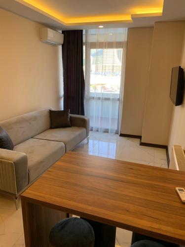 a living room with a couch and a table at Royal Residence Bursa in Bursa