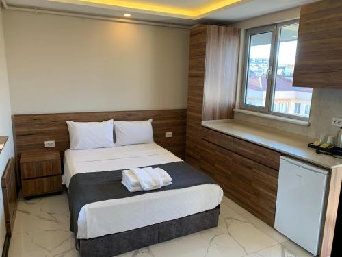 מיטה או מיטות בחדר ב-Royal Residence Bursa