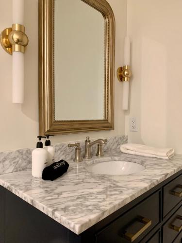 a bathroom with a sink and a mirror at The Inn in Buena Vista