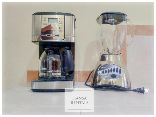 a blender sitting on top of a counter next to a mixer at Casa Hansa alojamientos vacacionales in Puerto Vallarta