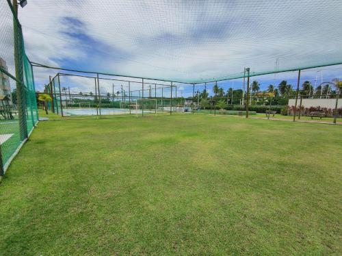 a baseball field with a fence and a baseball field at Porto de Galinhas | Muro Alto 116B in Porto De Galinhas