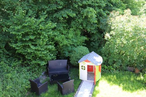 an aerial view of a toy dog house and chairs at Haus Berger in Fuschl am See