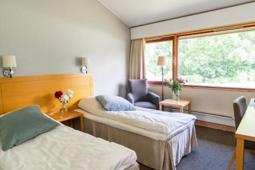 Postel nebo postele na pokoji v ubytování Thorbjørnrud Hotell