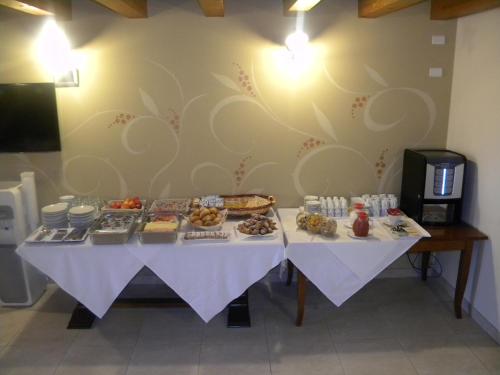 a table with a bunch of food on it at Agriturismo Aver in Villafranca di Verona
