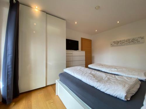 Posteľ alebo postele v izbe v ubytovaní Moderne Wohnung im Botenwirt Top 6"Almhütte"