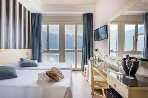 Un pat sau paturi într-o cameră la Hotel Splendid Palace