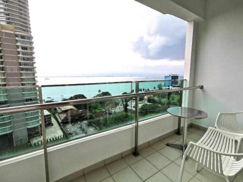 a balcony with a view of the ocean at Mansion One, Private Room in George Town