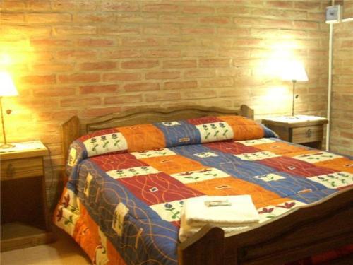 A bed or beds in a room at Complejo Los Ciruelos