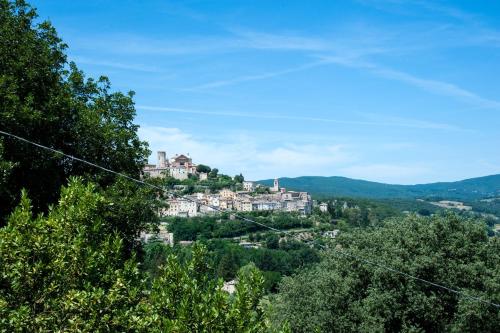 a town on top of a hill with trees at Charming House in Amelia with Lake View, 200 m² in Amelia