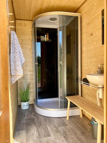 a bathroom with a shower and a sink at Kargaja Kuke Saun & Kämping in Padakõrve