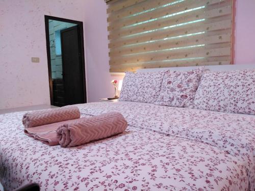a bed with two pillows on top of it at moon valley site jerash in Jerash