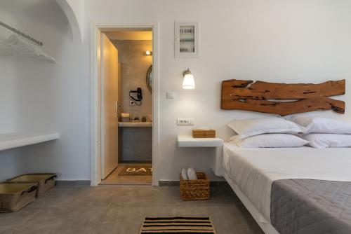 Ένα ή περισσότερα κρεβάτια σε δωμάτιο στο Miramare Suites Mykonos