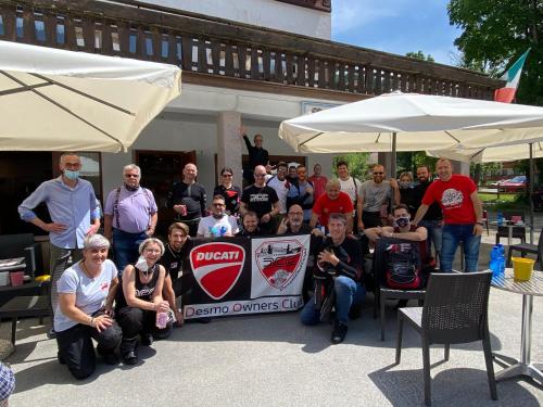 a group of people are posing for a picture at Hotel B&B Lorenzini Ski in Selva di Cadore