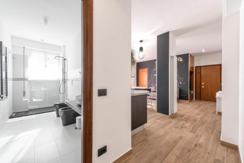 a large bathroom with a shower and a sink at G&C house in Rome