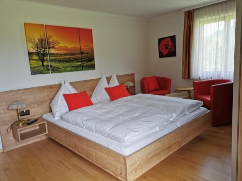A bed or beds in a room at Gut Römerhof