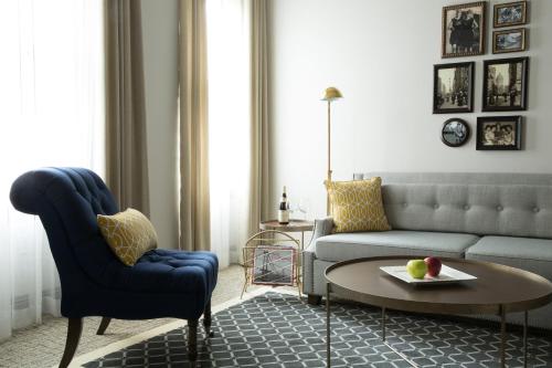 a living room with a couch and a table at Warwick San Francisco in San Francisco