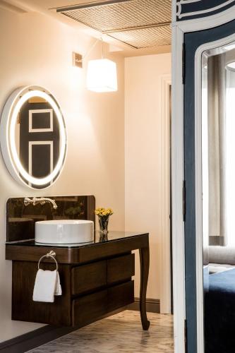 a bathroom with a sink and a mirror at Warwick San Francisco in San Francisco