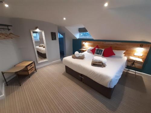 Säng eller sängar i ett rum på Cotswold Aparthotel