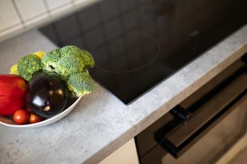 a bowl of vegetables sitting on a counter at Apartments Tonica in Malinska