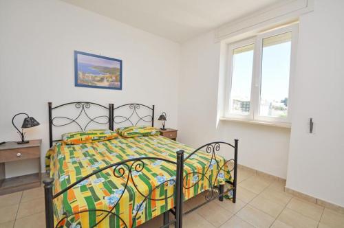 Postel nebo postele na pokoji v ubytování Residence Punta Pizzo