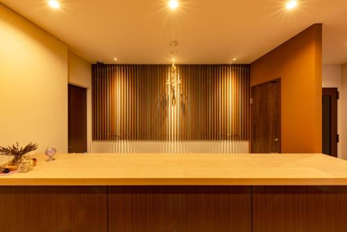 a large room with a stage in the background at plat hostel keikyu sapporo sky in Sapporo