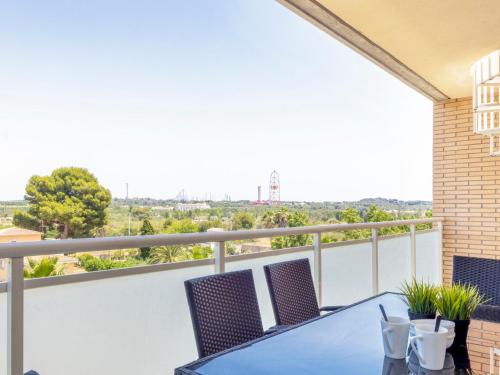 a balcony with a table and chairs and a view at Apartment Nou Salou in Salou