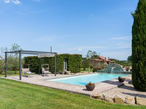 a swimming pool in a yard with a gazebo at Villa Cipresso by Interhome in Sutri