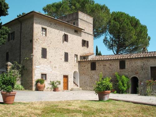 a large stone building with plants in front of it at Apartment Loggetta by Interhome in Podere Caminino