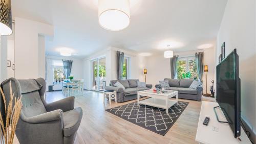 TV a/nebo společenská místnost v ubytování Polanki z sauną, Sun & Snow