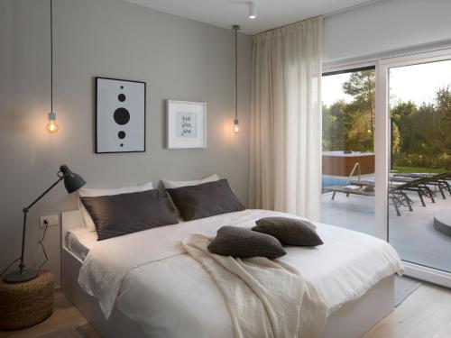 Postel nebo postele na pokoji v ubytování Villa Santa Marina by Interhome