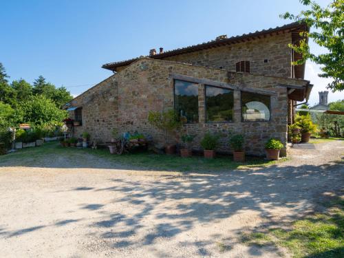 a brick house with plants in front of it at Holiday Home Le Buche by Interhome in Pelago