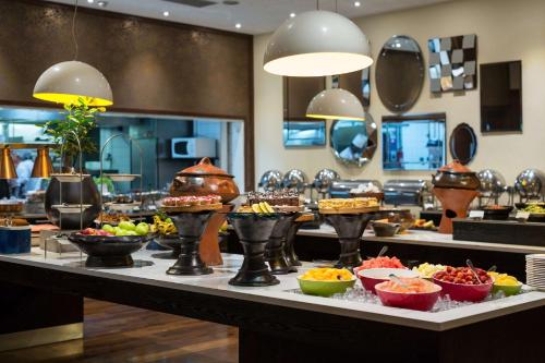 a buffet line with many different types of food at Radisson Blu Hotel, Addis Ababa in Addis Ababa