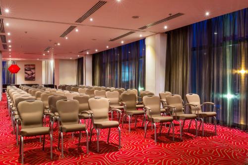 a room with a row of chairs in a room at Radisson Blu Hotel, Addis Ababa in Addis Ababa
