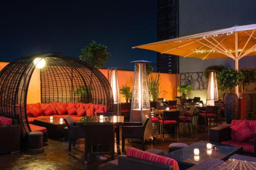 a restaurant with tables and couches and tables and chairs at Radisson Blu Hotel, Addis Ababa in Addis Ababa