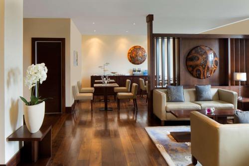 a living room with a couch and a table at Radisson Blu Hotel, Addis Ababa in Addis Ababa