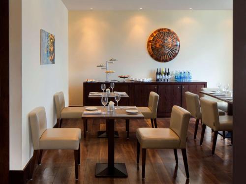 a dining room with a table and chairs at Radisson Blu Hotel, Addis Ababa in Addis Ababa