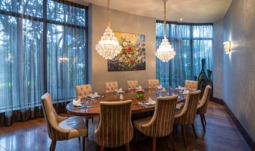 a dining room with a table and chairs at Radisson Blu Hotel, Addis Ababa in Addis Ababa