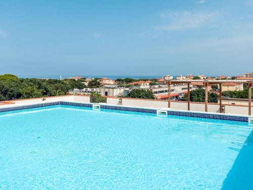 a large swimming pool on top of a building at Apartment Superior-4 by Interhome in San Vincenzo