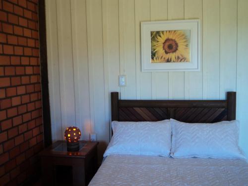 Cama ou camas em um quarto em Hotel Fazenda e Pousada Rancho da Guaiaca