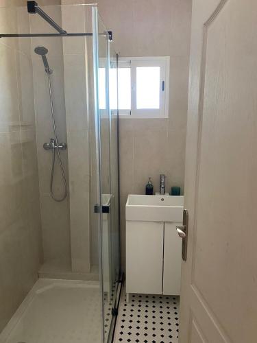 a bathroom with a shower and a sink at Villa Maioli in Olivella