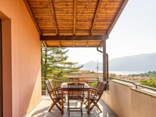 a patio with a table and chairs on a balcony at Apartment Residenza Agrifoglio-13 by Interhome in Luino