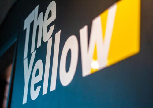 a close up of the kia logo on a wall at The Yellow by DOT Boutique in Guadalajara