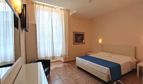 Postel nebo postele na pokoji v ubytování Hotel Rita Major