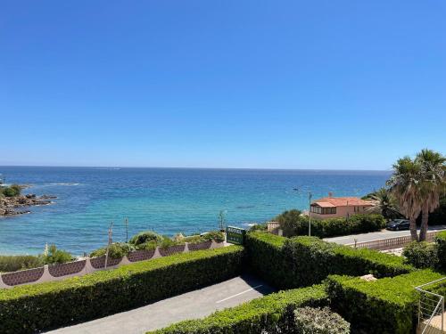 a view of the ocean from a house at "Cap Riviera" Hotel & Restaurant Saint Aygulf in Saint-Aygulf