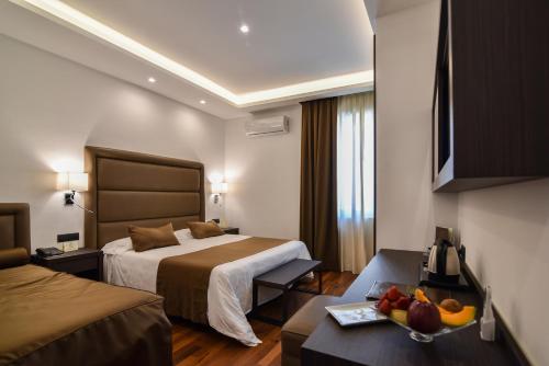 A bed or beds in a room at Hotel Palma