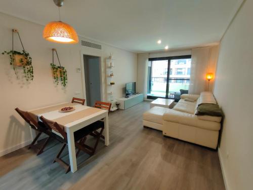 a living room with a couch and a table at NON STRESS First Level in Valencia