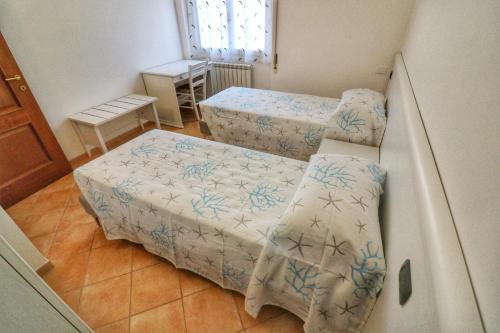 Кровать или кровати в номере La Pulce Salata